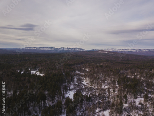 winter forest among the mountains in the middle zone of Russia © timursalikhov