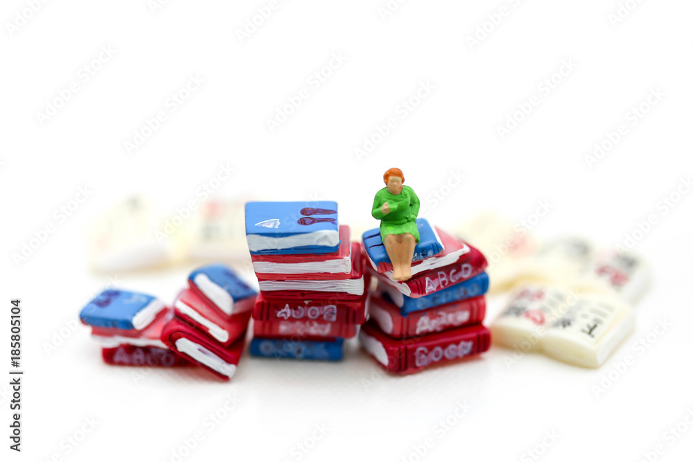 Miniature people :  reading books using as background education or business concept