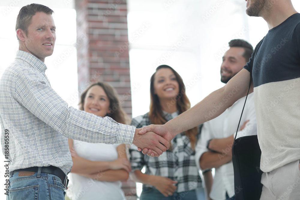 handshake business partners in the creative office. handshake business partners in the creative office.
