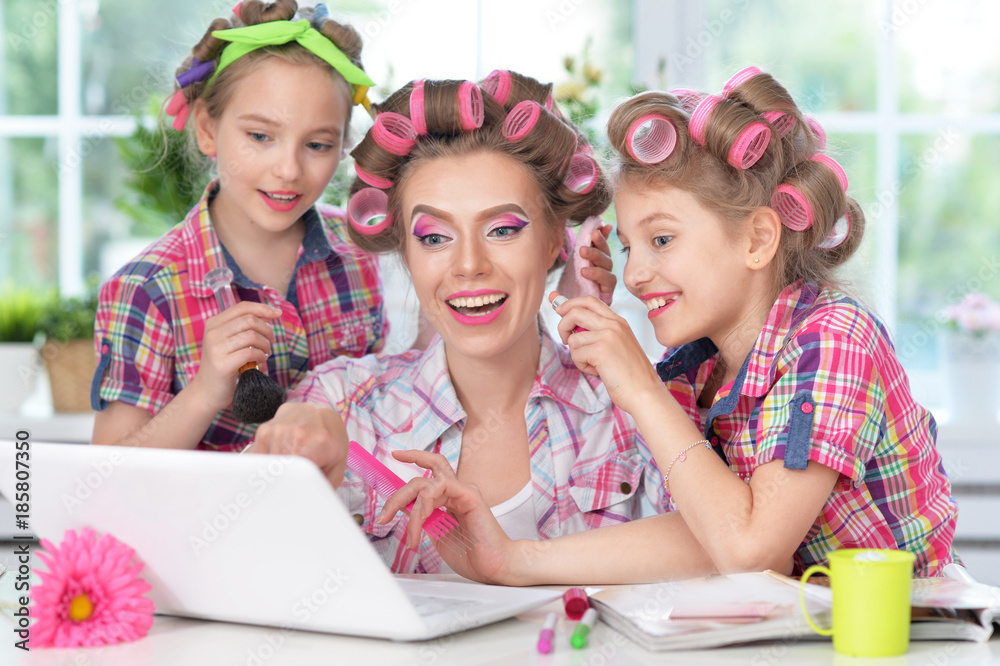 mother and daughters making hairstyles mother and daughters making hairstyles