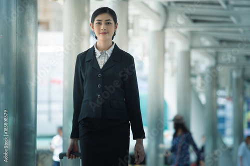 Asian smart business girl with outdoor building background