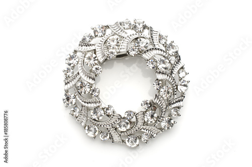 round brooch with diamonds isolated on white