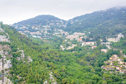 Daylight foggy view to Eze, Cote d'Azur village with medieval houses