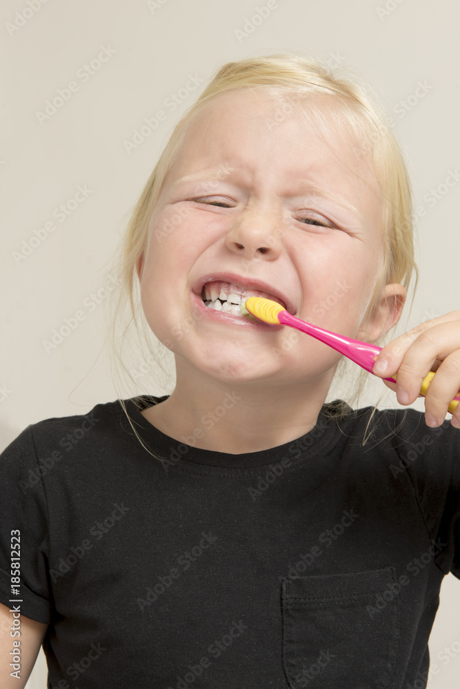 Portrait of Little Girl in Black Shirt Toothbrushing Portrait of Little Girl in Black Shirt Toothbrushing