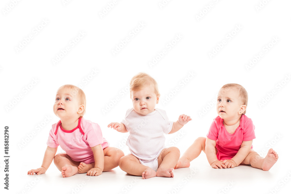 Three babies sitting Three babies sitting