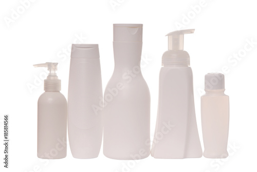 cosmetic tare, white bottles for shampoo and hair conditioner; isolated vials on white
