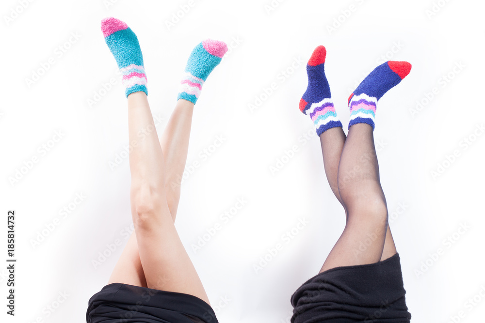 two girlfriends showing legs with winter socks