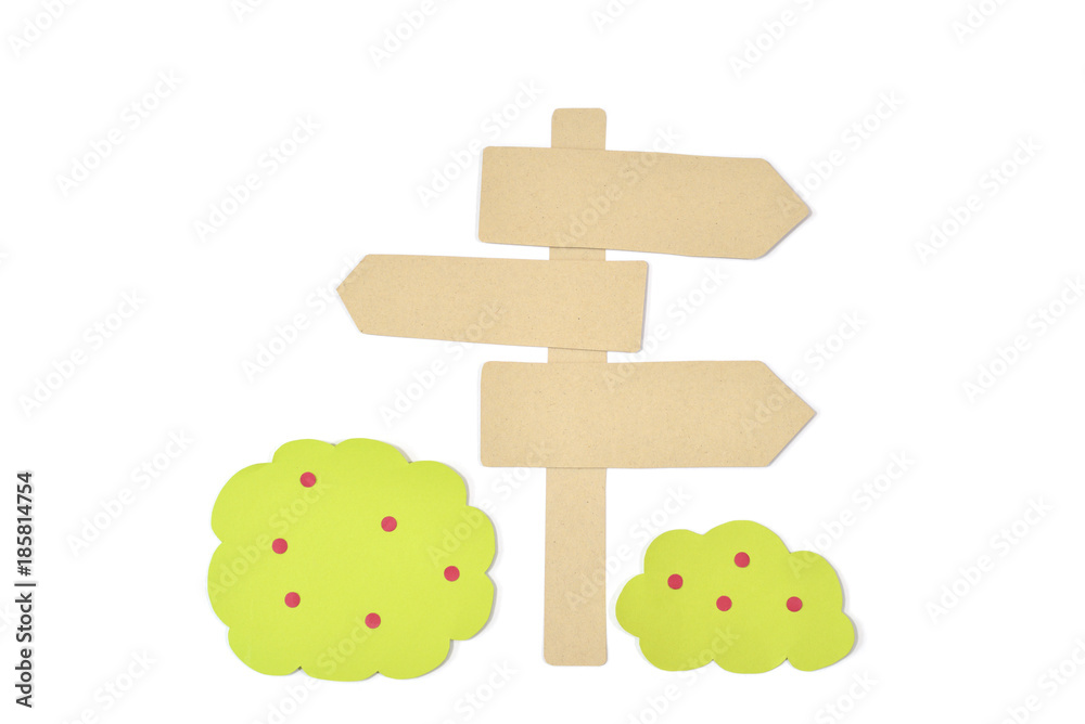 Fototapeta premium Blank wooden direction signpost and bush paper cut on white background - isolated