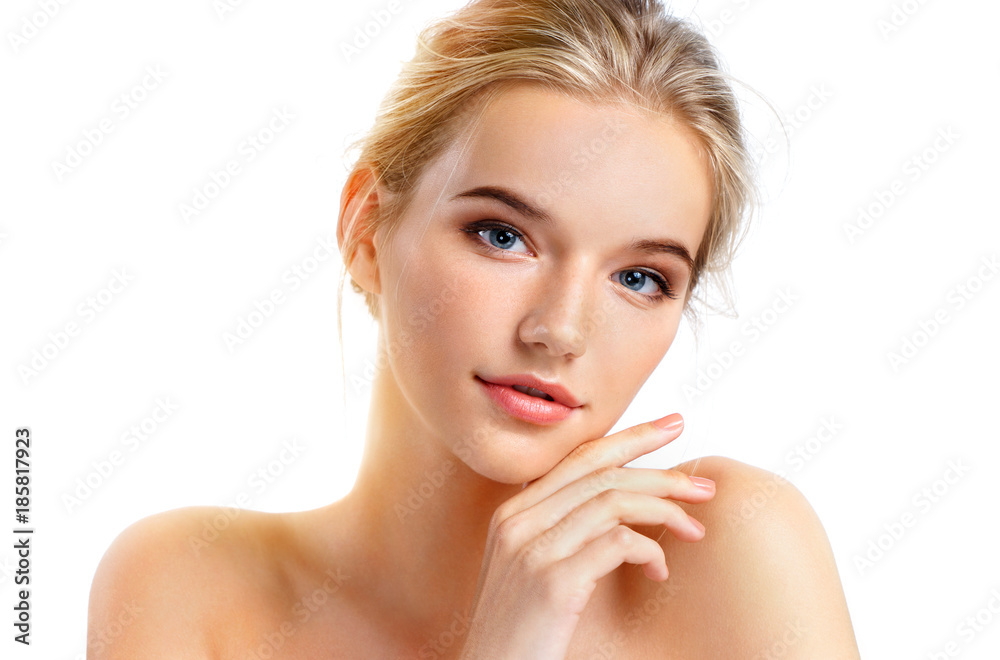 Fototapeta premium Young pretty girl with naturarl makeup isolated on white background. Skin care concept