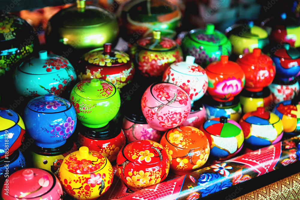 Coconut shell bowls on the wooden shelf. Souvenir coconut bowls selling on the market Coconut shell bowls on the wooden shelf. Souvenir coconut bowls selling on the market