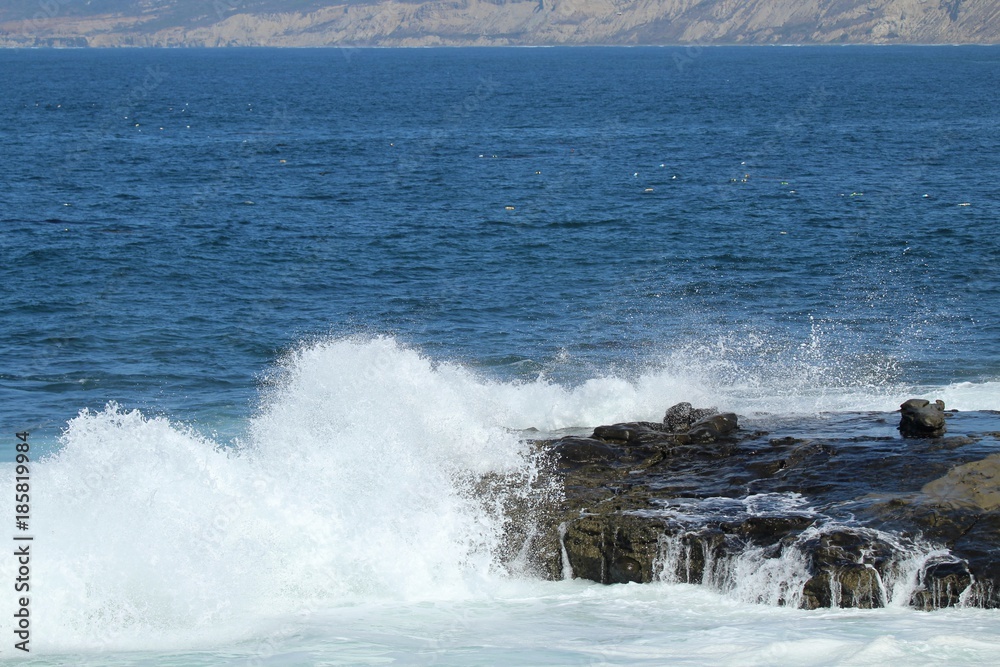 Waves splashing on ocean cliff