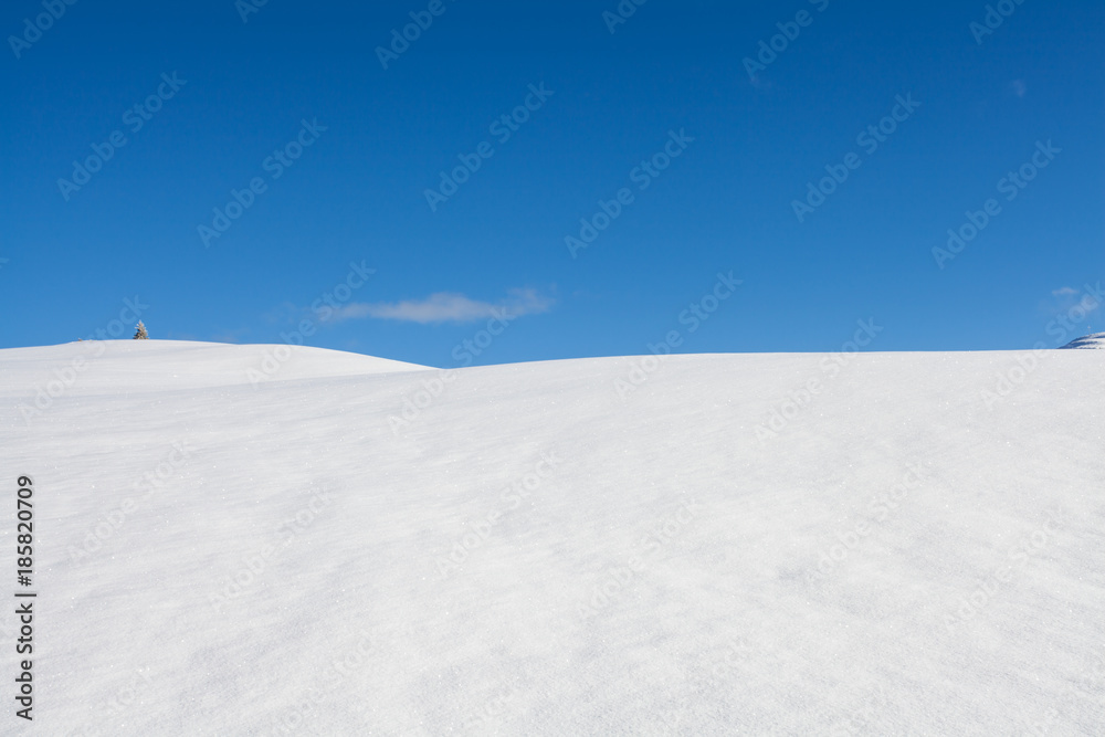 Winter background snow and blue sky landscape in south tirol Italy
