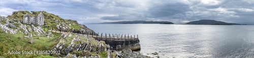 The rooten pier at craignish point with the Sound of Jura and the Islands of Scarba and Jura in the background © Lukassek