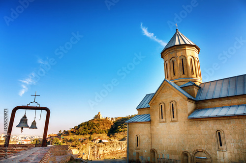 Church and bells on the territory of the ancient fortress Narikala, old Tbilisi, Georgia photo
