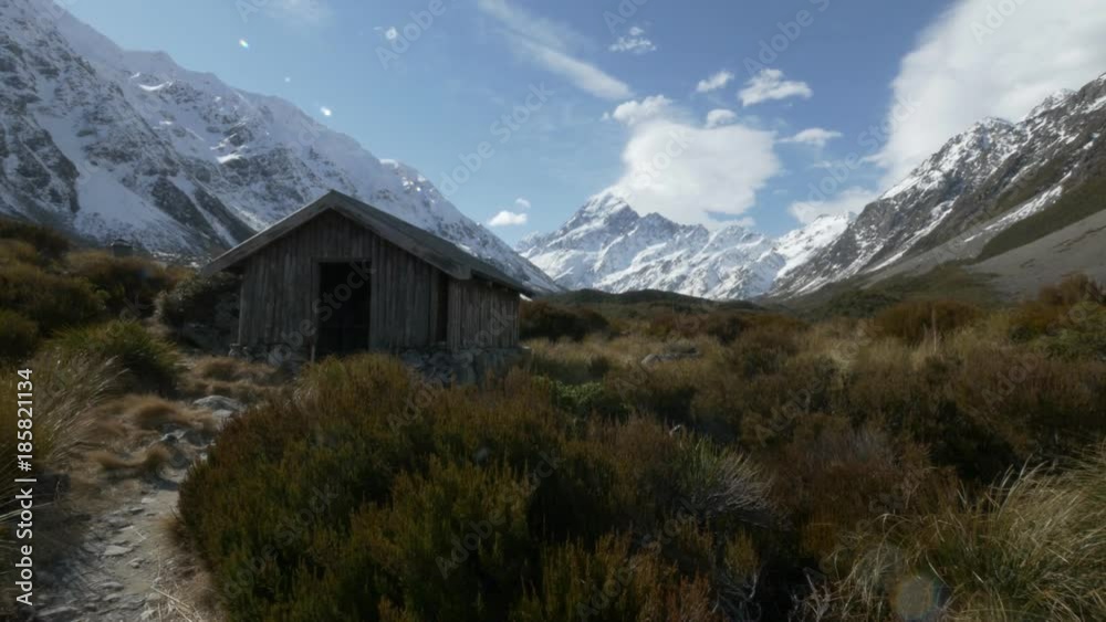 a slider wide angle shot of  stocking stream shelter and mount cook in new zealand
