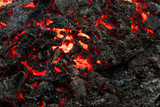 Lava flame on black ash background