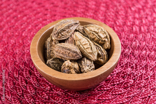 Pile of harde pods on a cloth background photo