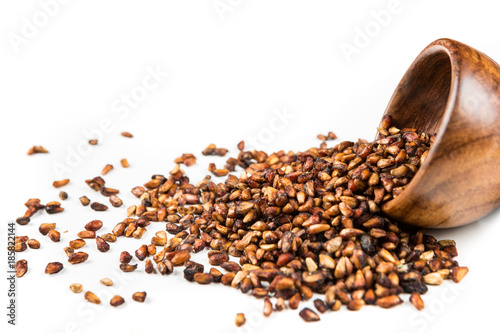 Bild auf Leinwand Pile of dried pomegranate seeds isolated on a white background