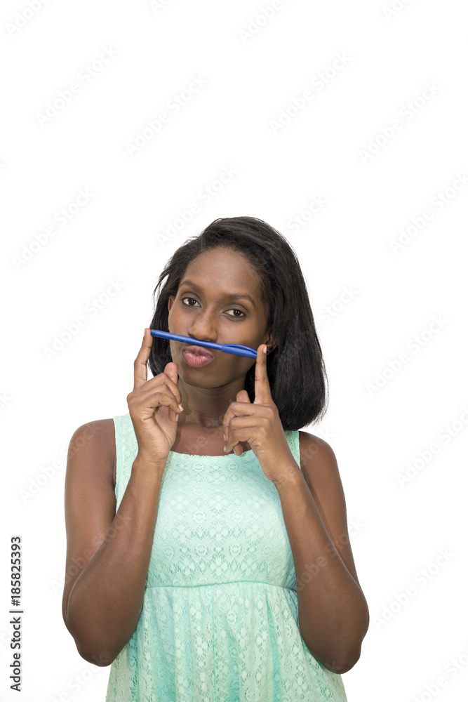 Woman holding pen between nose and lip