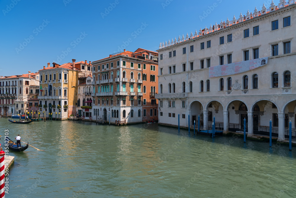 Magnificent daily view of Gondola with classical buildings along the famous Grand canal in Venice, Italy