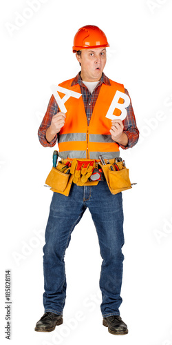 Full length portrait of a male builder in a orange helmet over white wall background. repair, construction, building, people and maintenance concept..