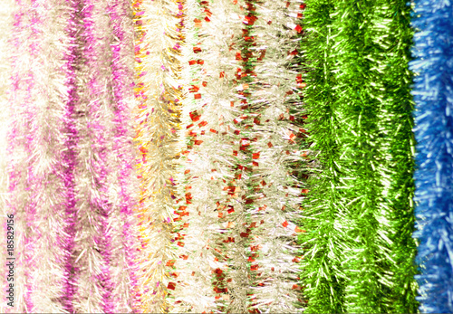 tinsel gold, blue, red, silver, around the edges soft focus close-up