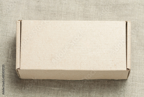 Cardboard box on a wooden background