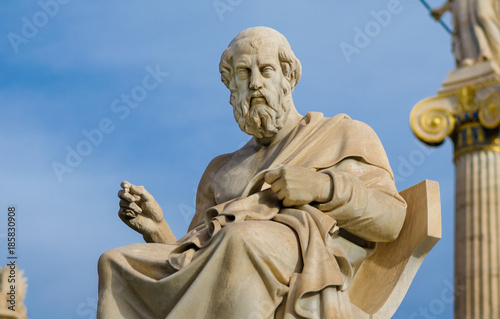 Statue of the great philosopher of ancient Greece Plato, on the background of a marble column.