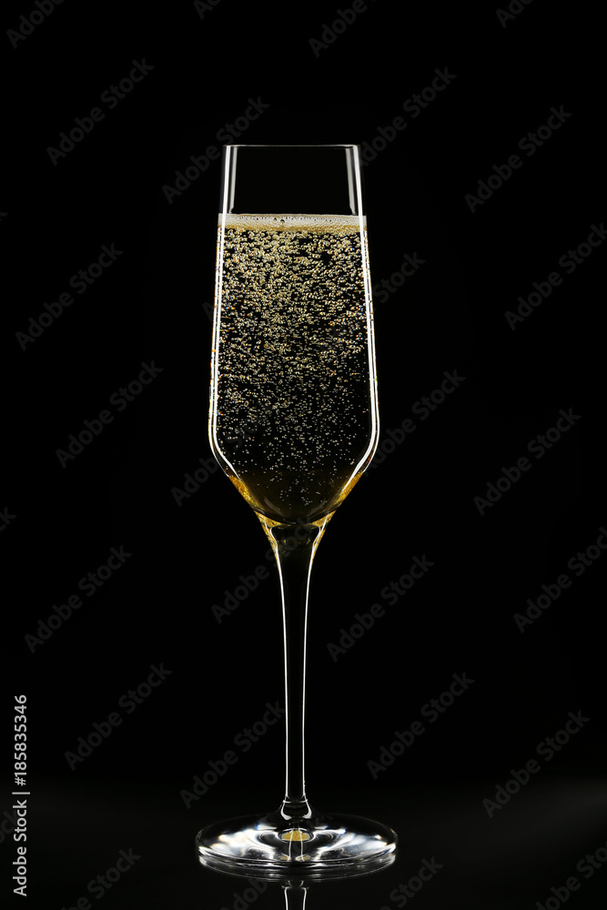 Foto Stock Champagne glass on black background | Adobe Stock