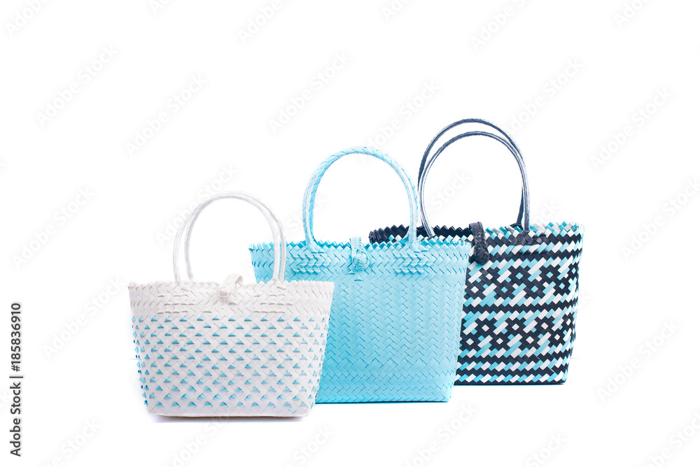 three wicker woman's tote bags, isolated on white background