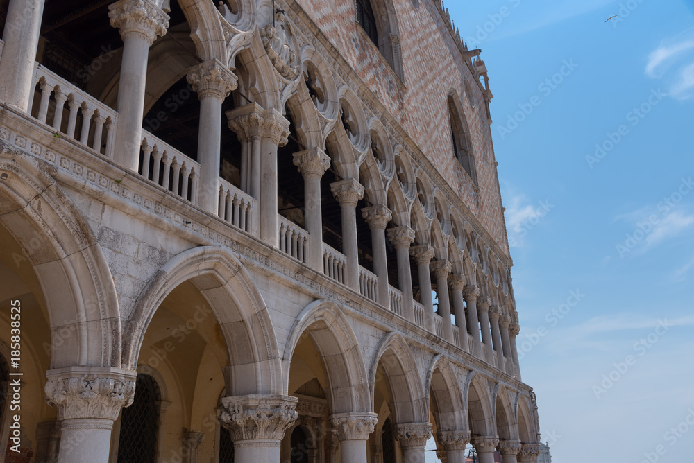 Part of the facade of Doge's Palace (Palazzo Ducale) in Venice during the day show the detailed gothic style architecture