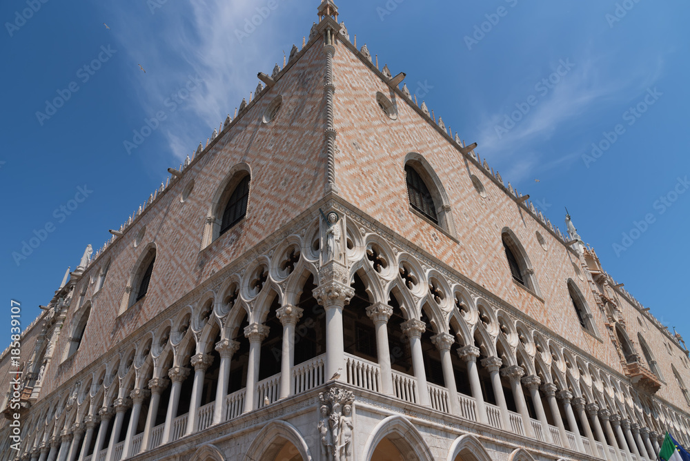 Part of the facade of Doge's Palace (Palazzo Ducale) in Venice during the day show the detailed gothic style architecture