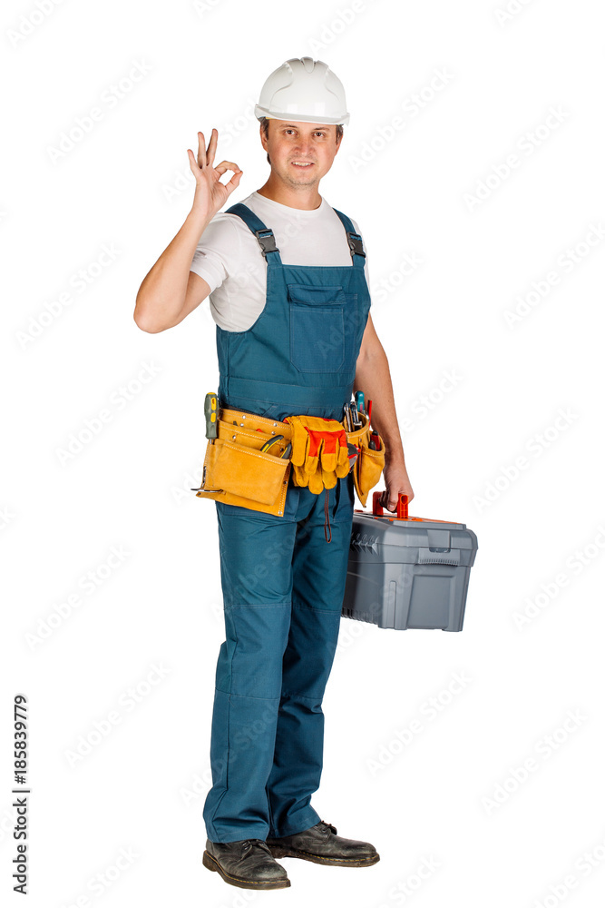 Full length portrait of a male builder in with helmet over white wall background. repair, construction, building, people and maintenance concept. Full length portrait of a male builder in with helmet over white wall background. repair, construction, building, people and maintenance concept.