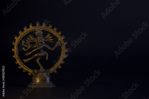 statue of the goddess kali of bronze in meditation photo