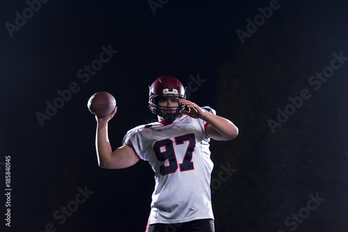 american football player throwing rugby ball