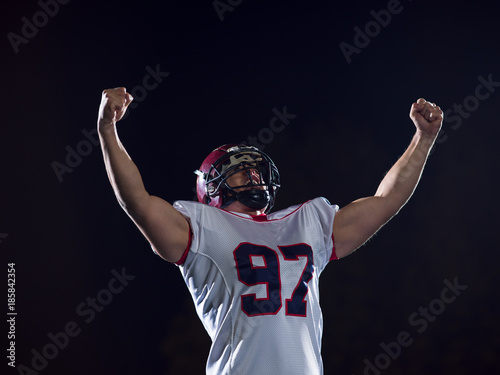 american football player celebrating after scoring a touchdown