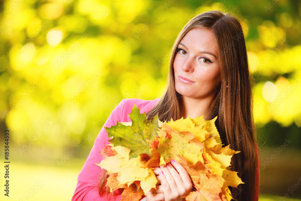 Fall season. Portrait girl woman with bunch of autumnal leaves Fall season. Portrait girl woman with bunch of autumnal leaves