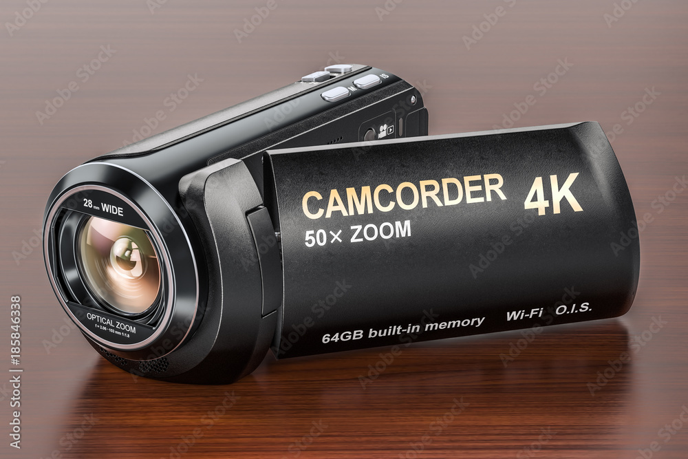 Naklejka premium Camcorder, videocamera on the wooden table. 3D rendering