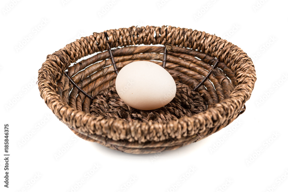 Farm fresh eggs in a basket on a white background