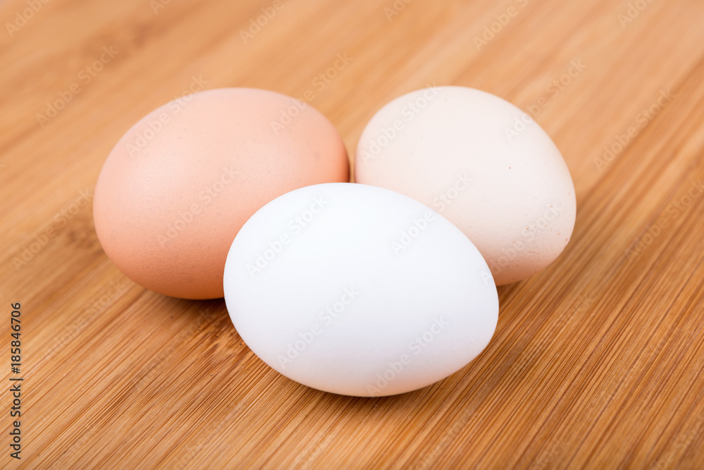 Farm fresh eggs on a wood background Farm fresh eggs on a wood background