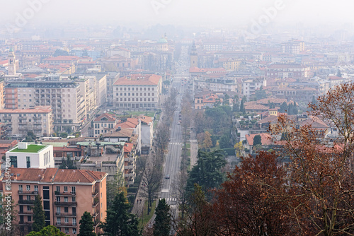Aerial view on central street of foggy Bergamo town  Italy