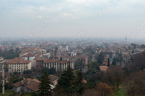 Aerial panoramic view on foggy Bergamo town in northern Italy