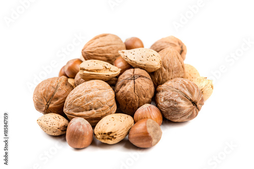 Mixed nuts in shell on a white background
