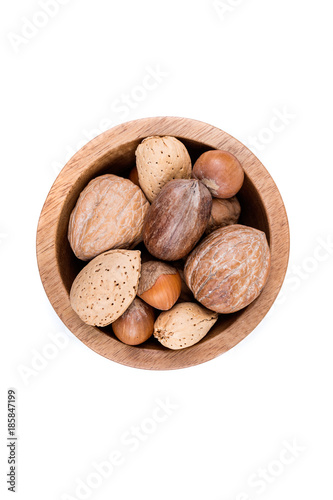 Mixed nuts in shell  in a bowl on a white background photo