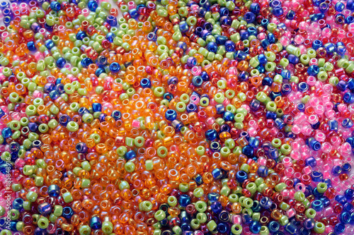 Texture made with colorful small glass balls with holes