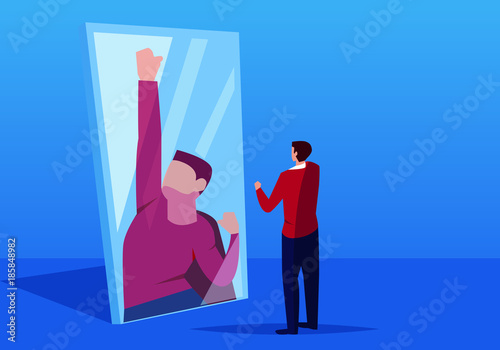 Businessman looks in the mirror