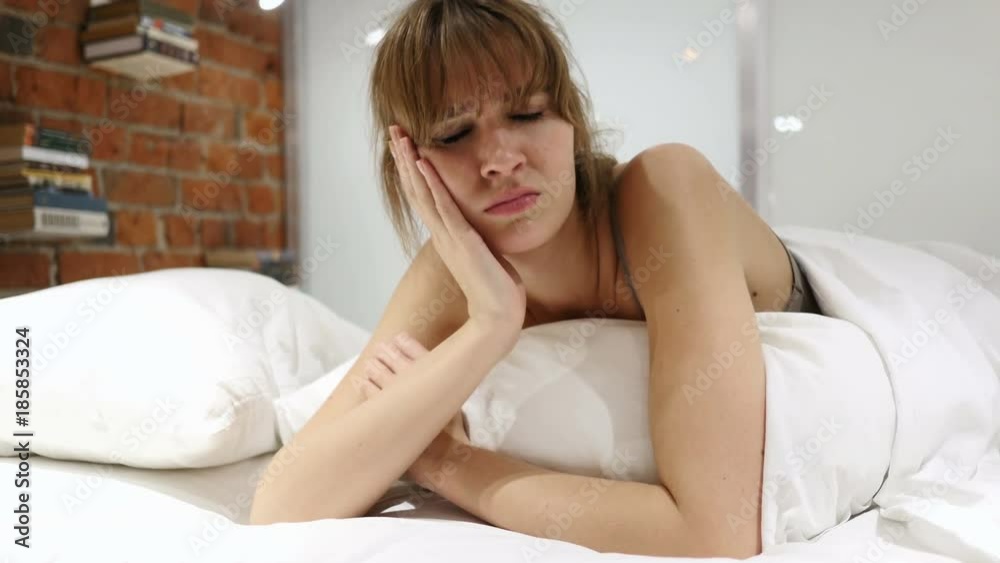 Frustrated Woman Lying in Bed Suffering Teeth Pain, Toothache Frustrated Woman Lying in Bed Suffering Teeth Pain, Toothache