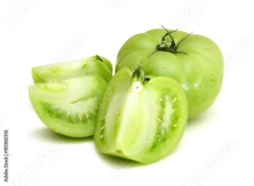 Green Tomato and slice on white