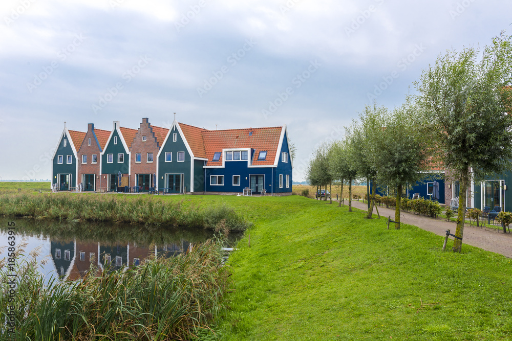 Volendam is a town in North Holland in the Netherlands. Colored houses of marine park in Volendam. North Holland, Netherlands.. Volendam is a town in North Holland in the Netherlands. Colored houses of marine park in Volendam. North Holland, Netherlands..