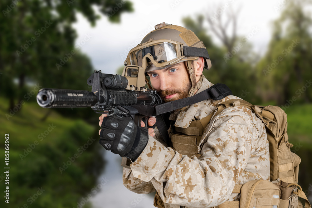 Fototapeta premium Modern soldier with rifle